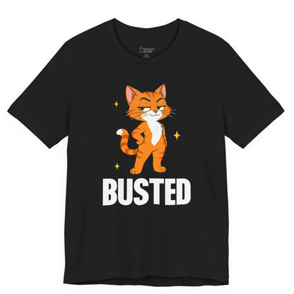 Snarky cat t-shirt with Busted slogan and standing orange cat graphic on black shirt