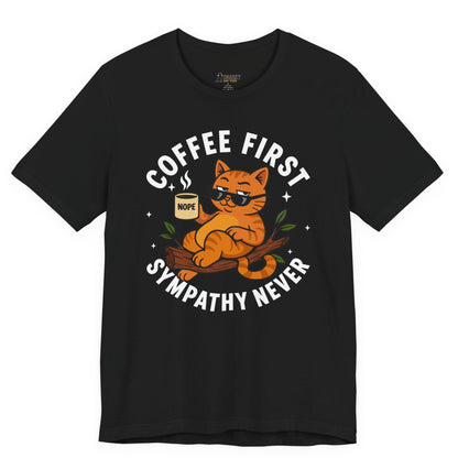 Funny cat t-shirt with Coffee First Sympathy Never slogan and lounging cat graphic on black shirt