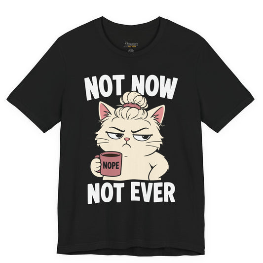 Funny cat t-shirt with Not Now Not Ever slogan and messy bun cat graphic on black shirt