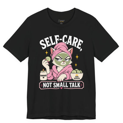 Funny cat t-shirt with Self-Care Not Small Talk slogan and spa cat graphic on black shirt