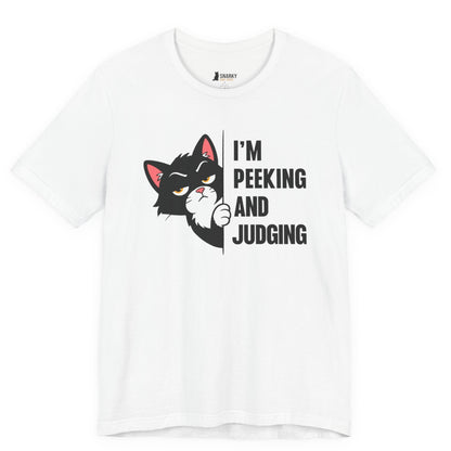 Snarky cat t-shirt with I’m Peeking and Judging slogan and black peeking cat graphic on white shirt