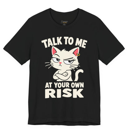 Funny cat t-shirt with Talk to Me at Your Own Risk slogan and attitude cat graphic on black shirt