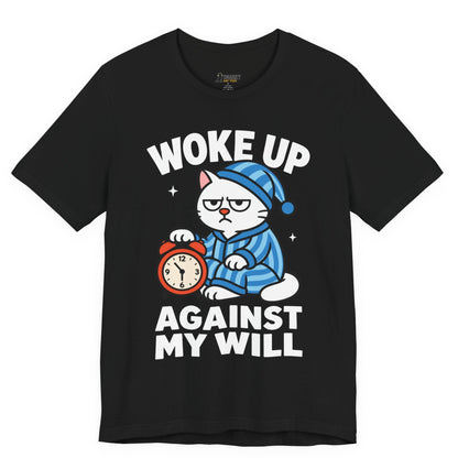 Funny cat t-shirt with Woke Up Against My Will slogan and pajama cat graphic on black shirt