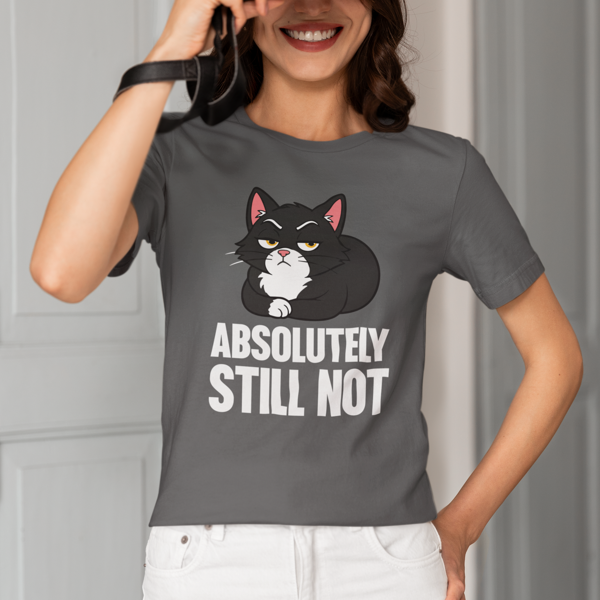 Model wearing Absolutely Still Not Loaf Cat T-Shirt with black loaf cat graphic design