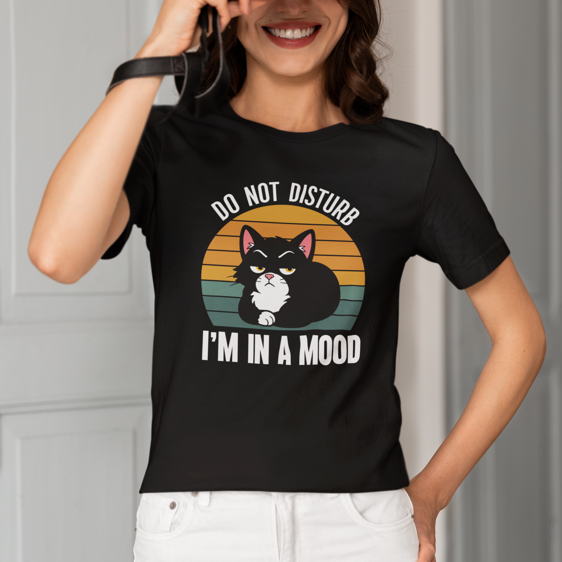 Model wearing Do Not Disturb Mood Cat T-Shirt with retro black cat graphic design
