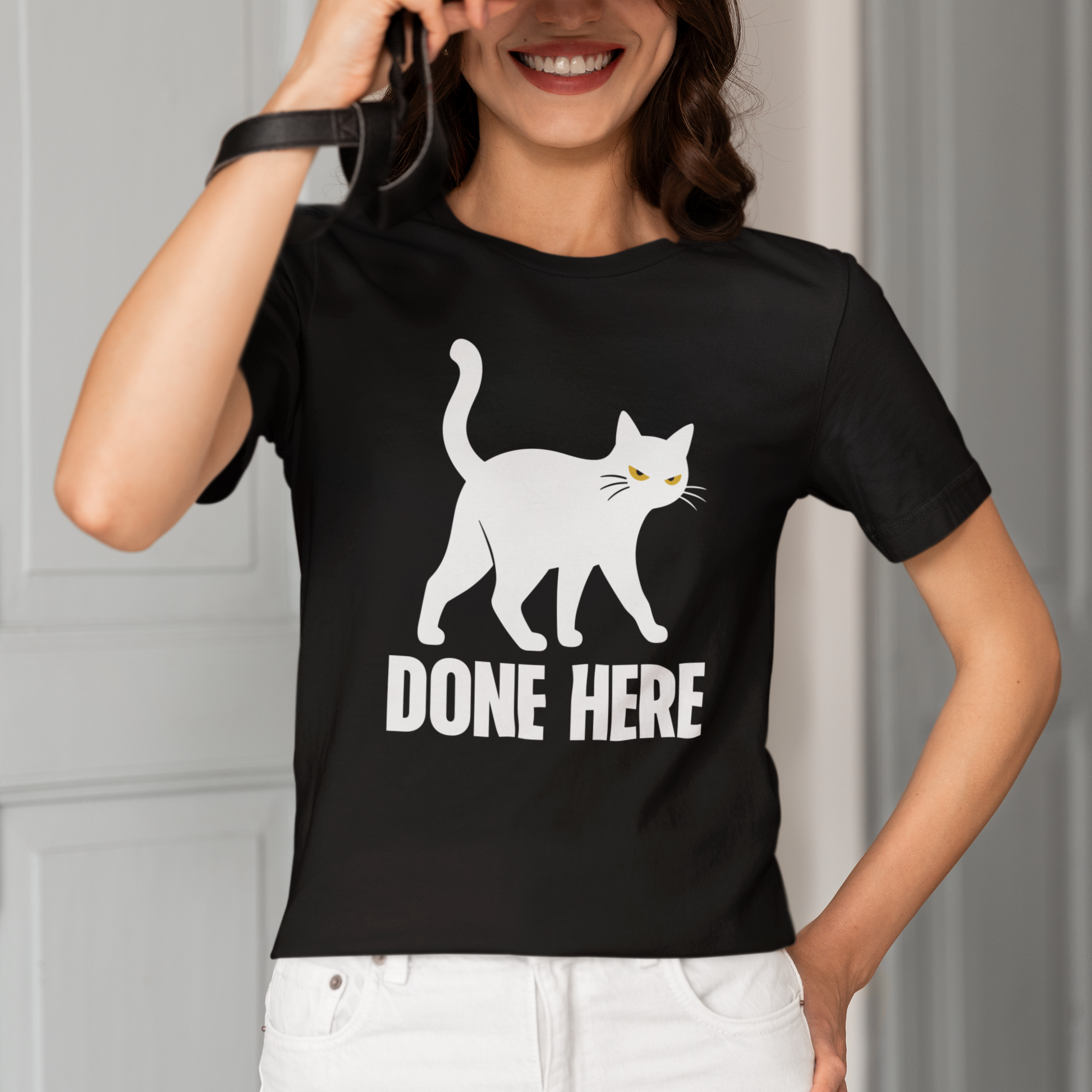 Model wearing Done Here Walking Cat T-Shirt with white walking cat graphic design