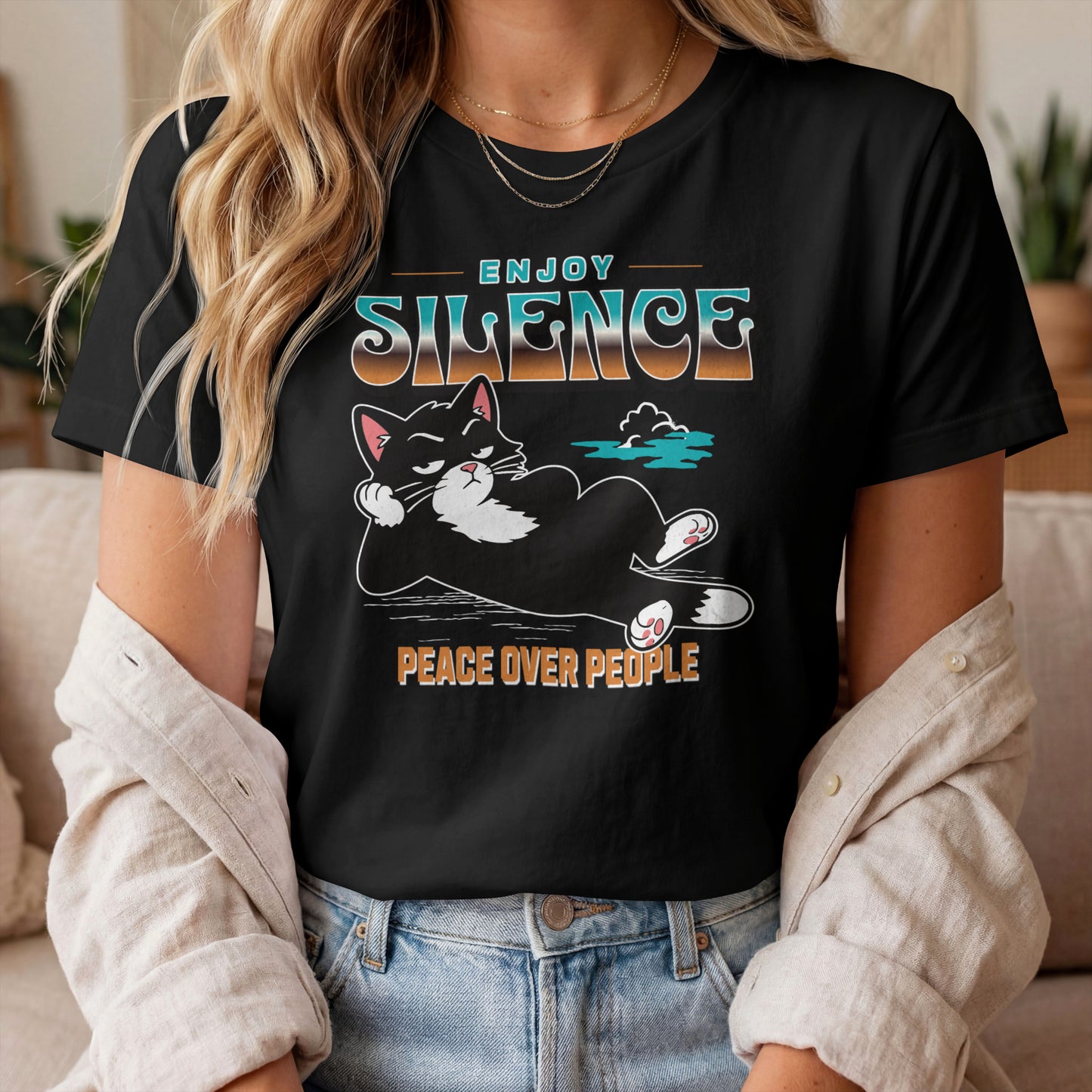 Model wearing Peace Over People Lounging Cat T-Shirt with lounging black cat graphic design