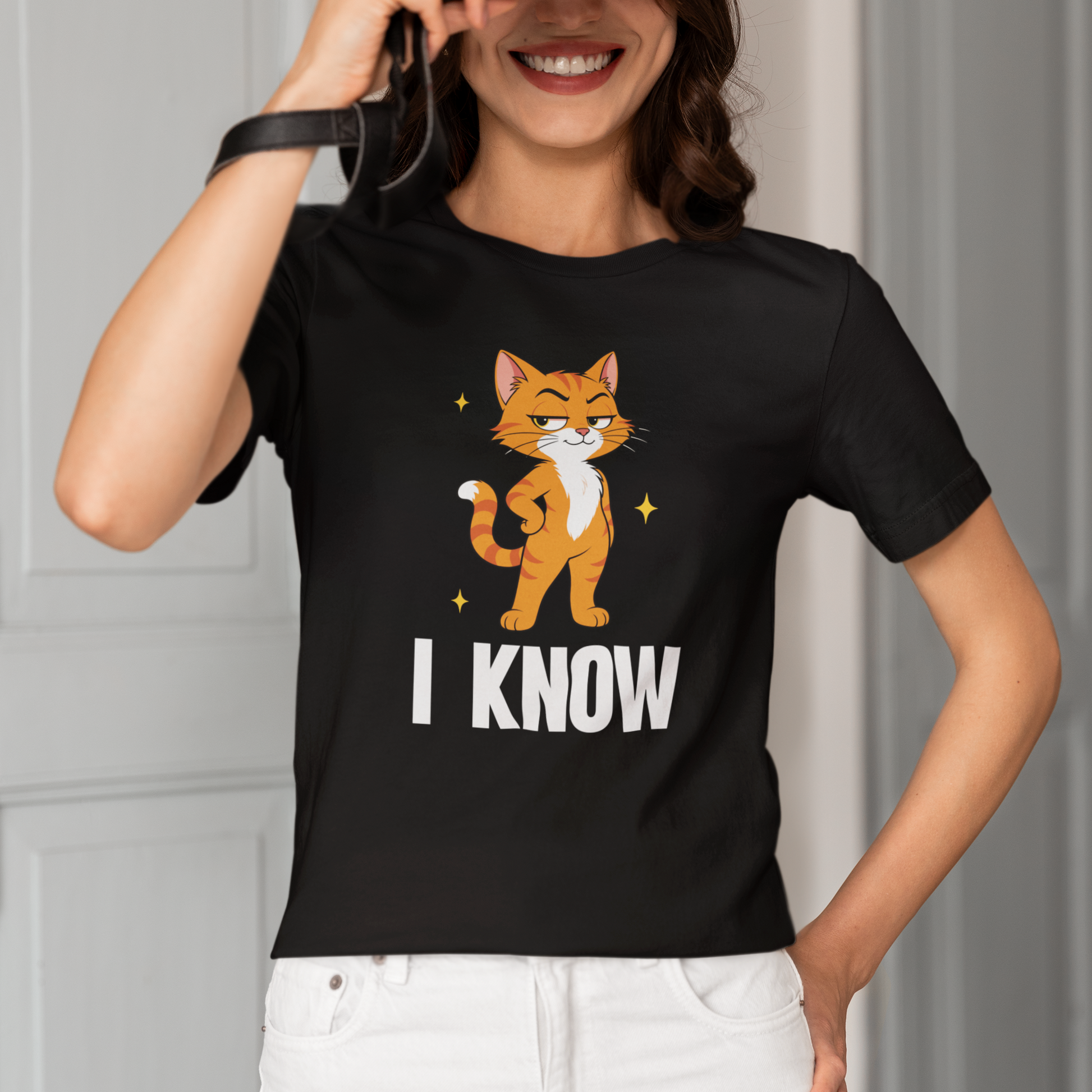 Model wearing I Know Judgy Cat T-Shirt with standing orange cat graphic design
