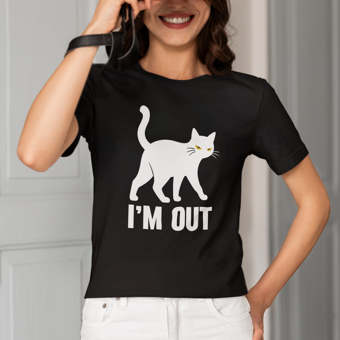 Model wearing I’m Out Walking Cat T-Shirt with white walking cat graphic design