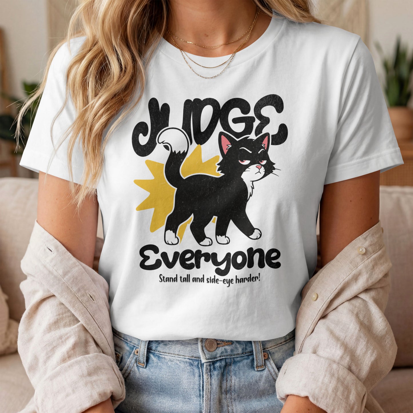Model wearing Judge Everyone Crown Cat T-Shirt with crown cat graphic design