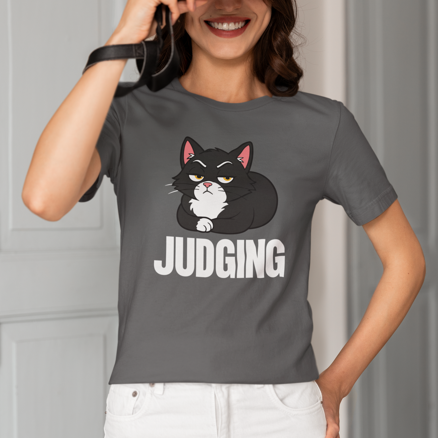 Model wearing Judging Loaf Cat T-Shirt with black loaf cat graphic design