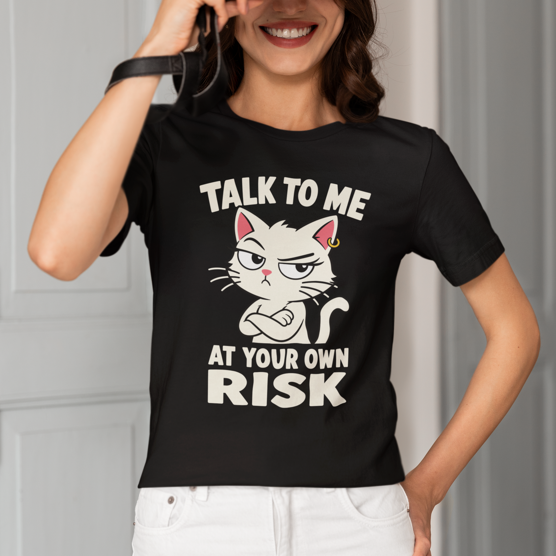 Model wearing Talk to Me Risk Cat T-Shirt with white attitude cat graphic design