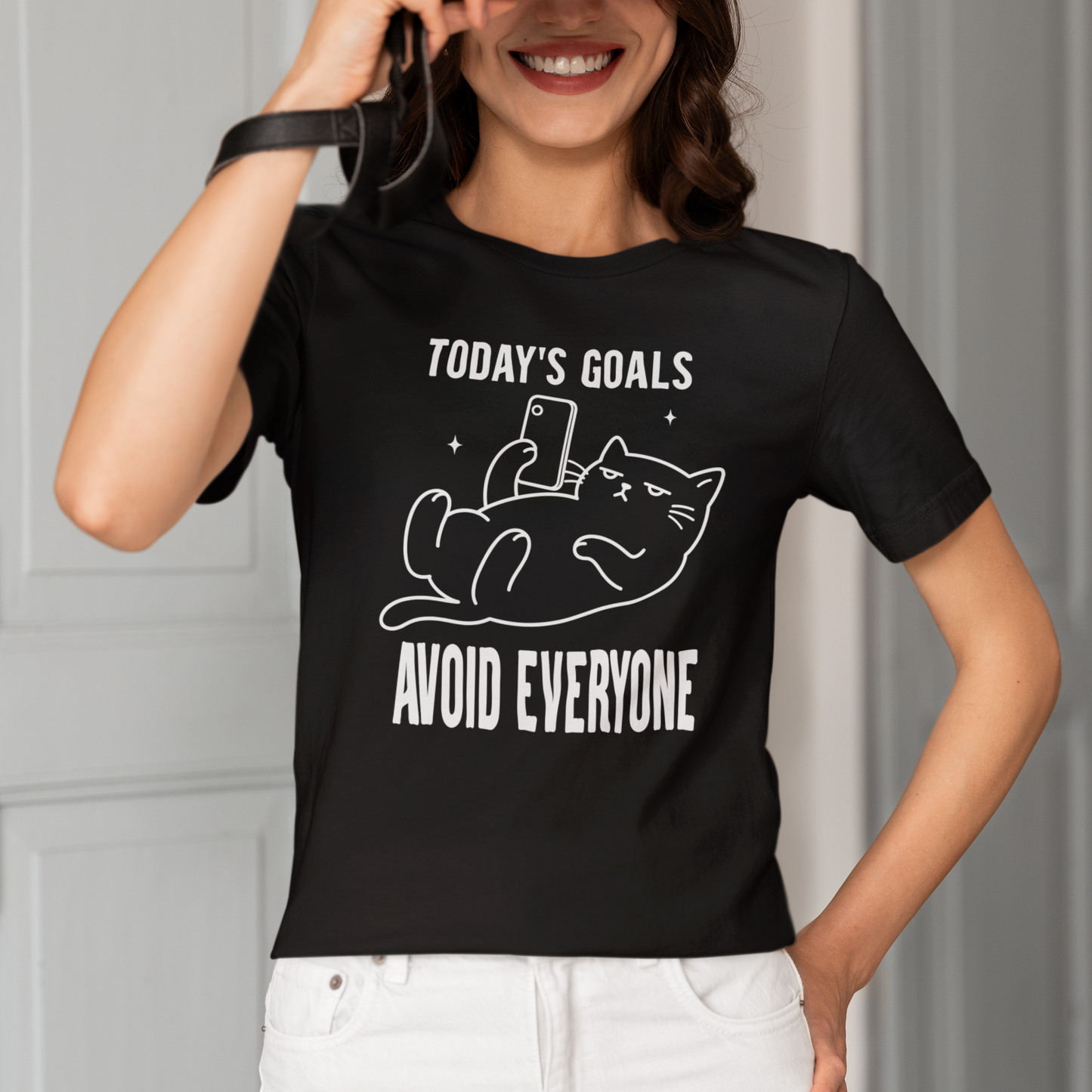 Model wearing Avoid Everyone Phone Cat T-Shirt with white phone cat graphic design