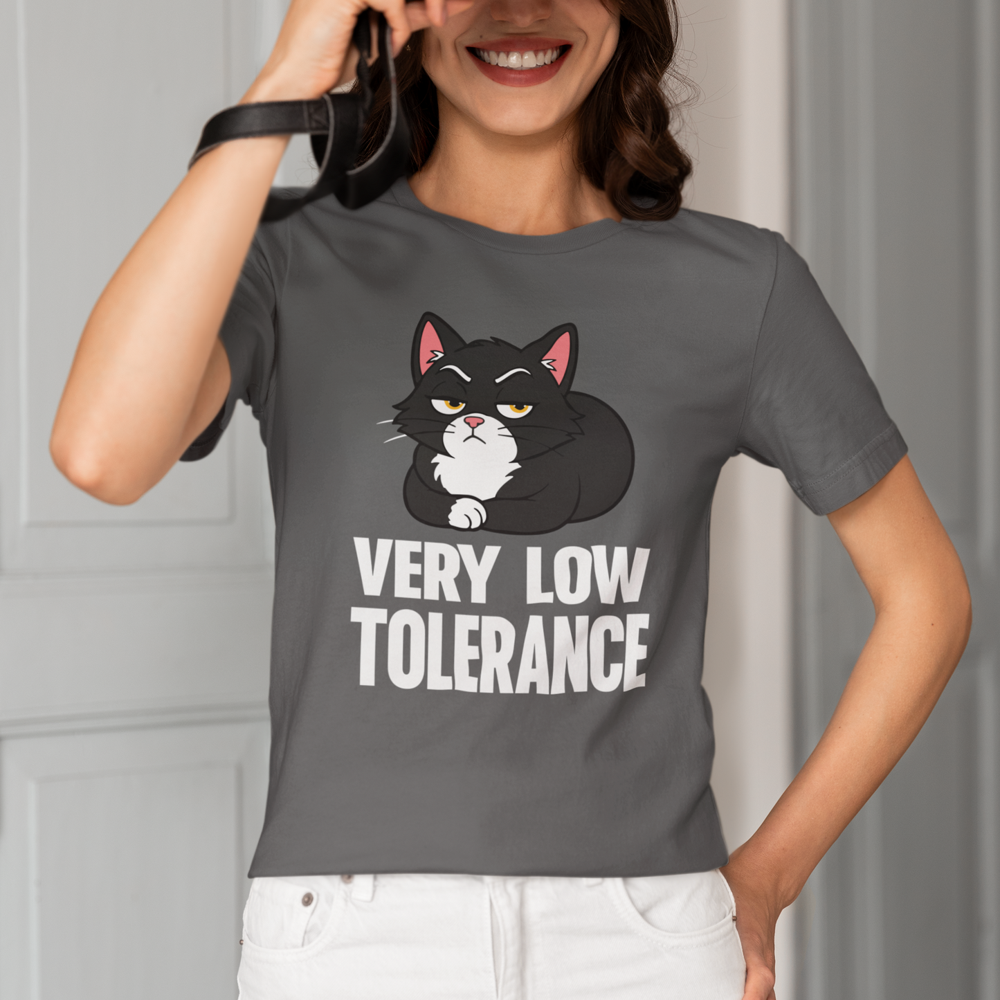 Model wearing Very Low Tolerance Loaf Cat T-Shirt with black loaf cat graphic design