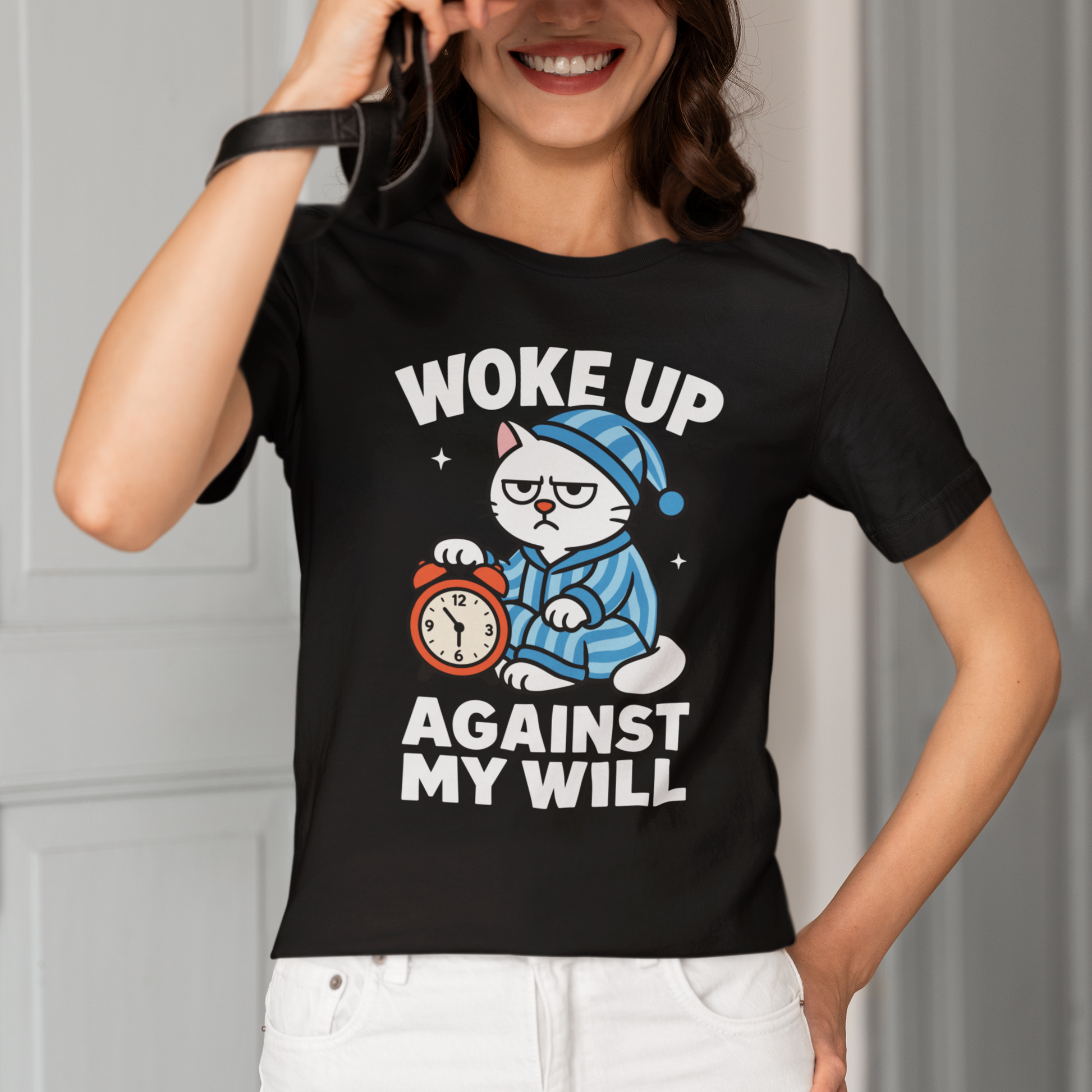 Model wearing Woke Up Against My Will Pajama Cat T-Shirt with sleepy cat graphic design